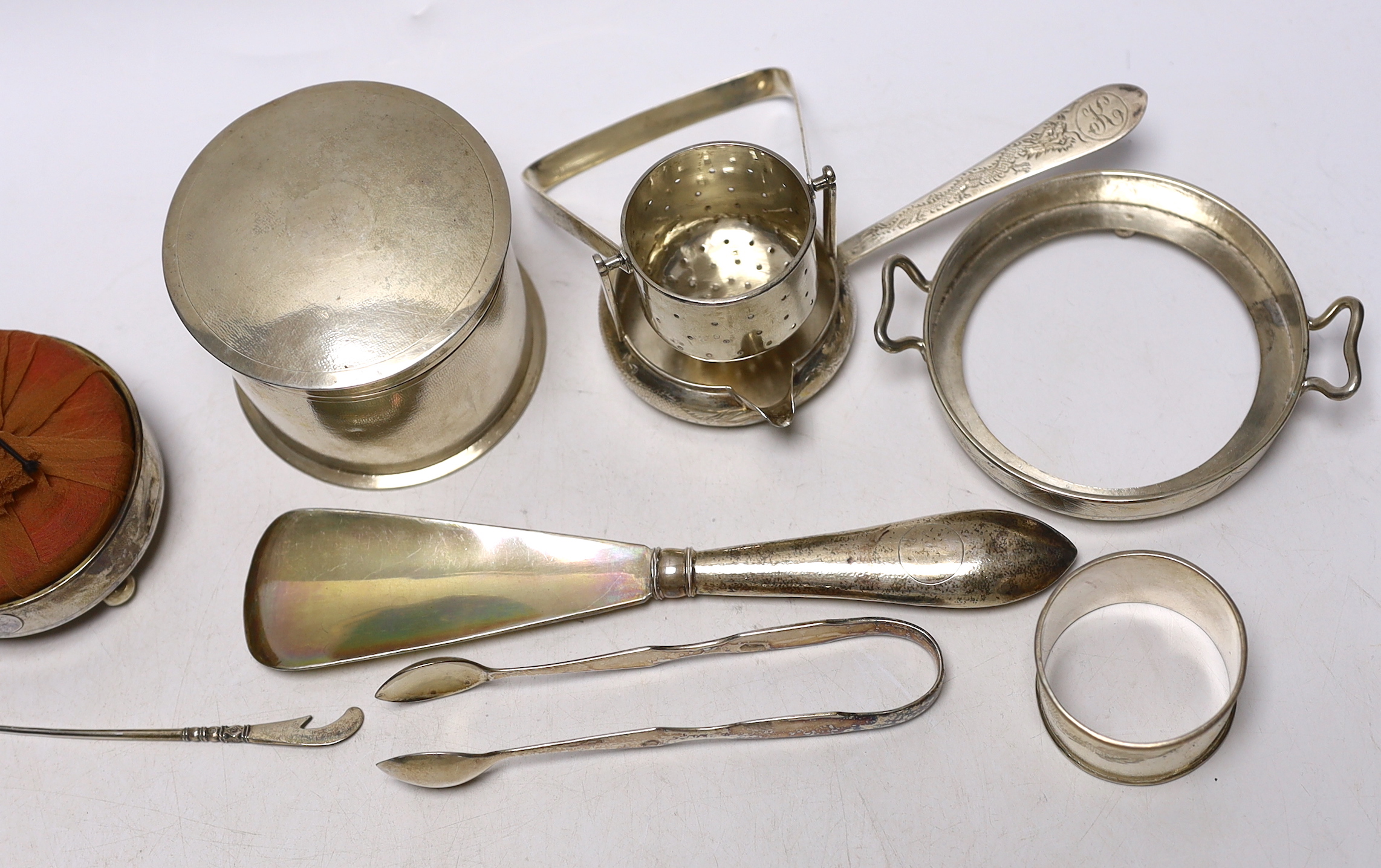 A group of assorted Chinese white metal items, including a box and cover by Lainchang, base by Zeesung, tea strainer napkin ring, etc and a mounted pin cushion by Tok Sang, 74mm.